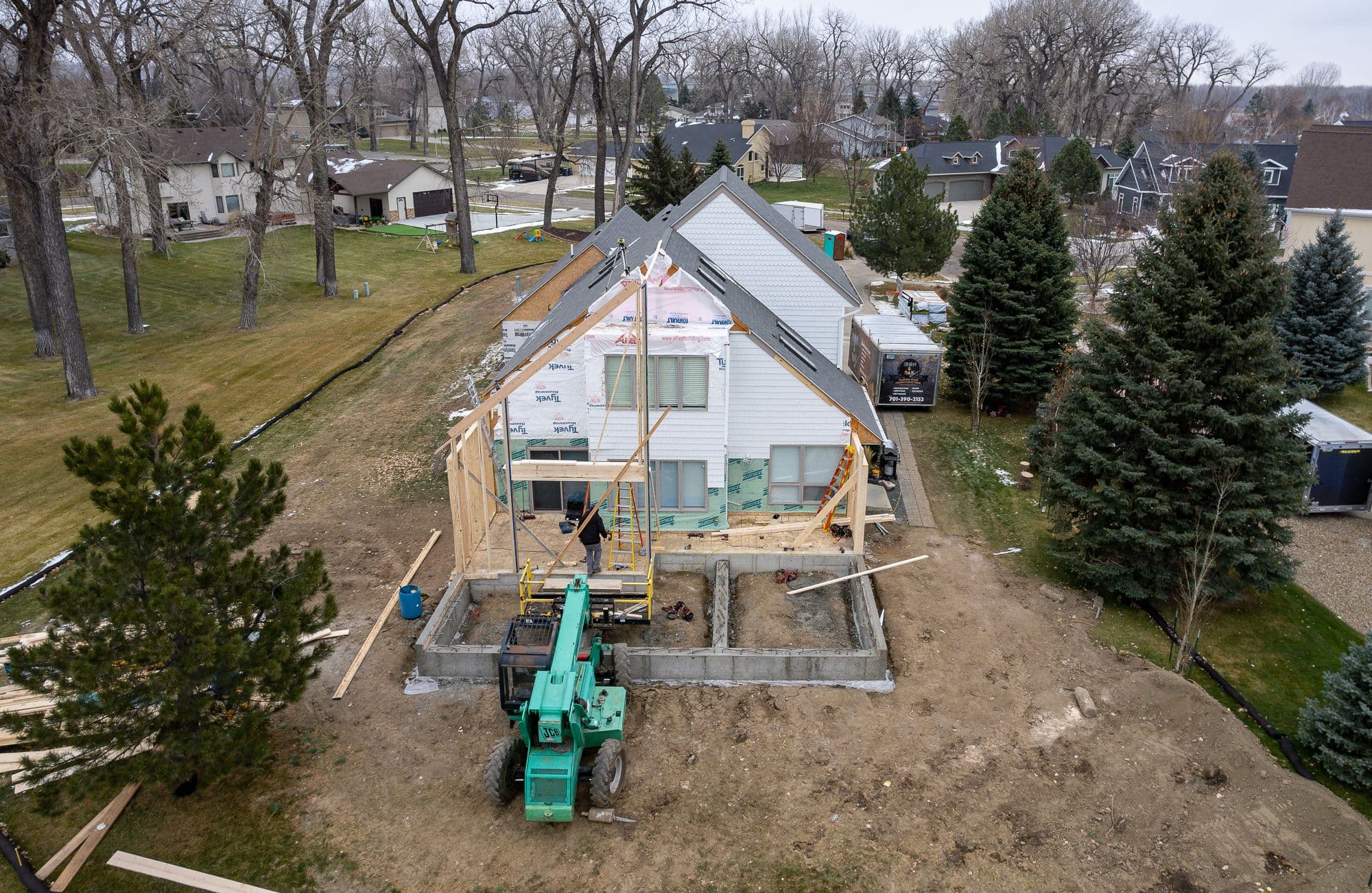 new deck, living room extension, and master bed room under construction 